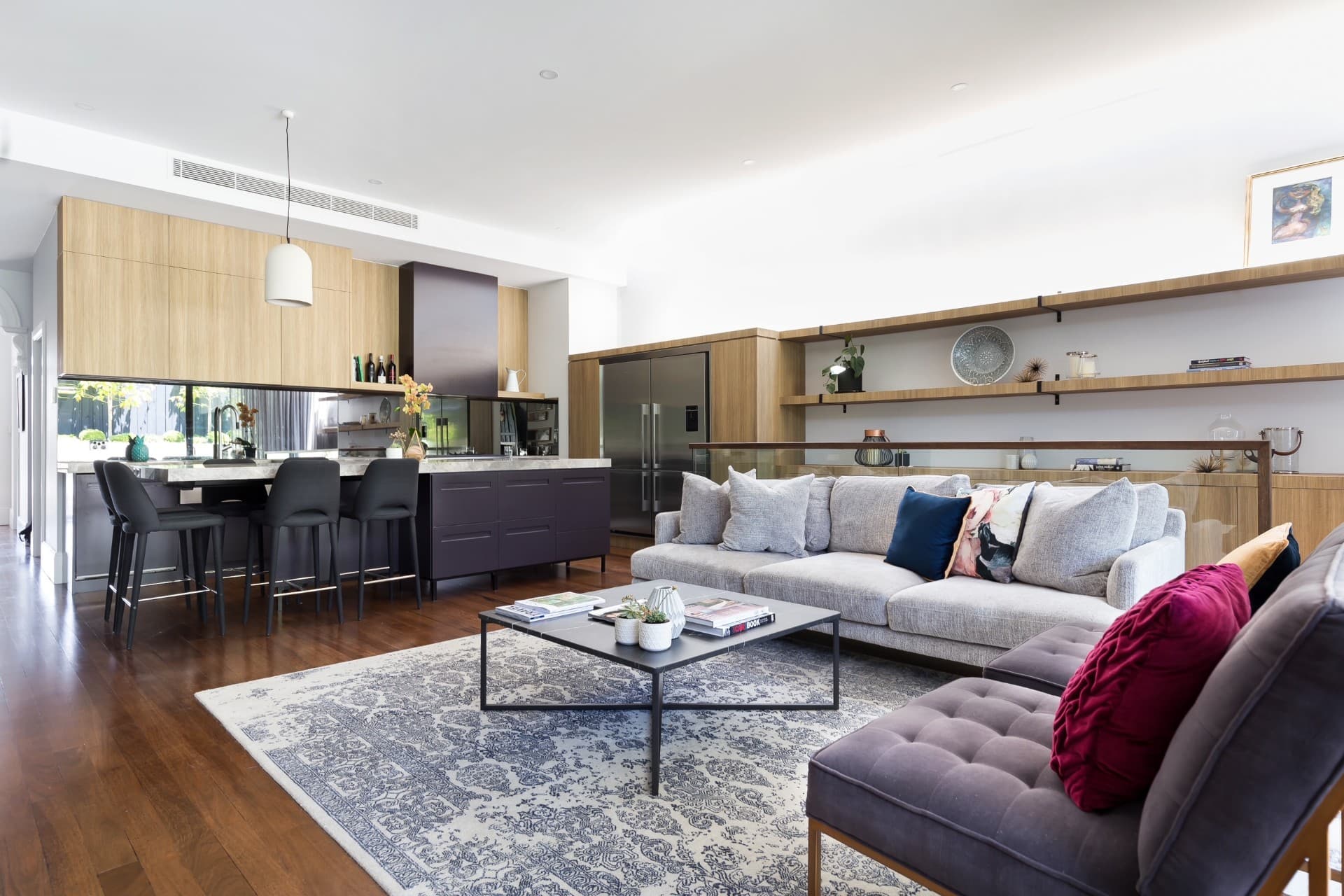 KBLCO kitchen renovation, Sydney. Dark joinery kitchen open to the living room.
