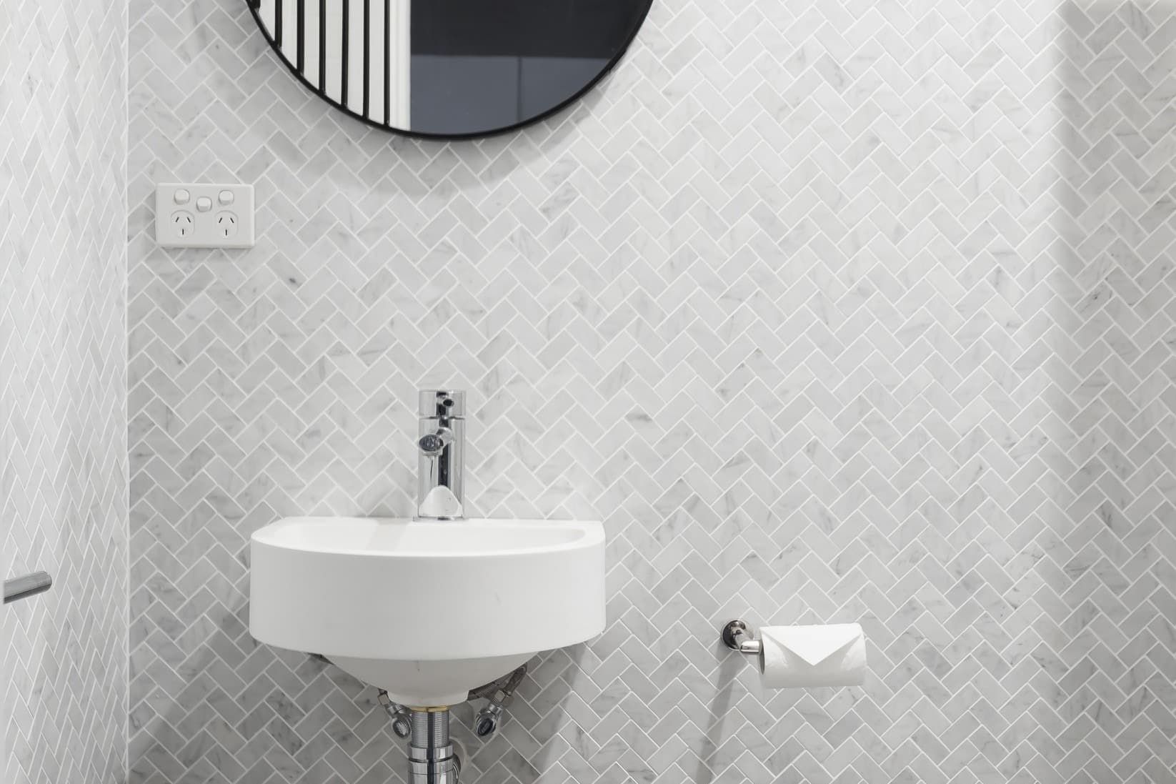 KBLCO bathroom renovation, Sydney. Herringbone marble mosaic powder room.