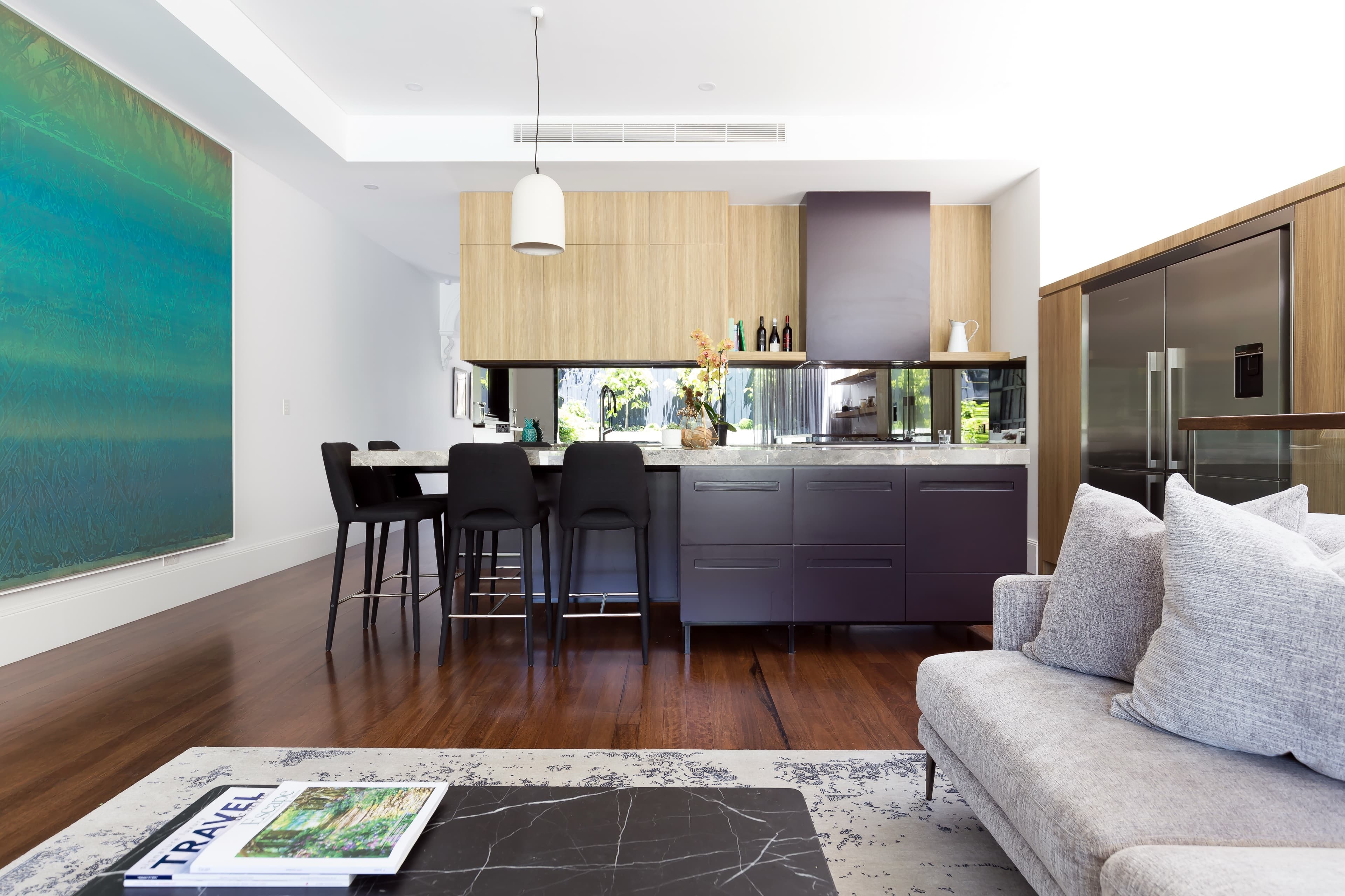 KBLCO living room, Sydney. Open-plan living and dining in a restrained palette.