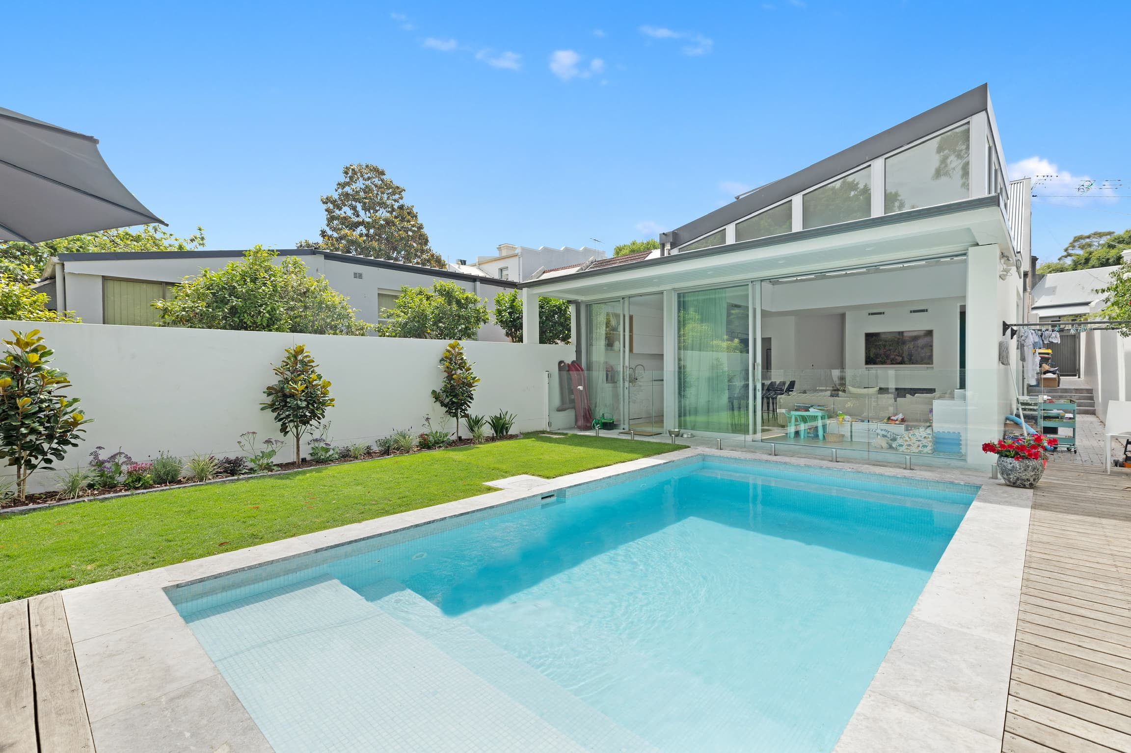 A Sydney home designed by the studio, with a pool and landscaped garden off the living wing.