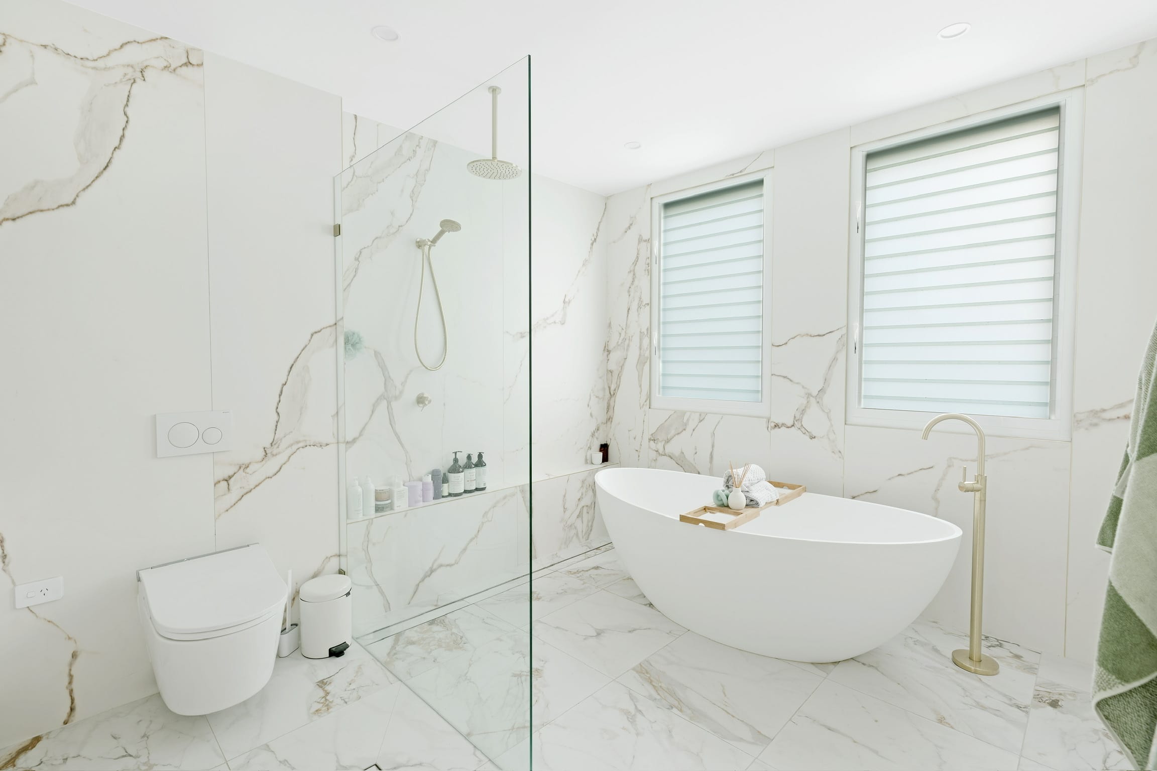 Albion calacatta ensuite with double stone basins.