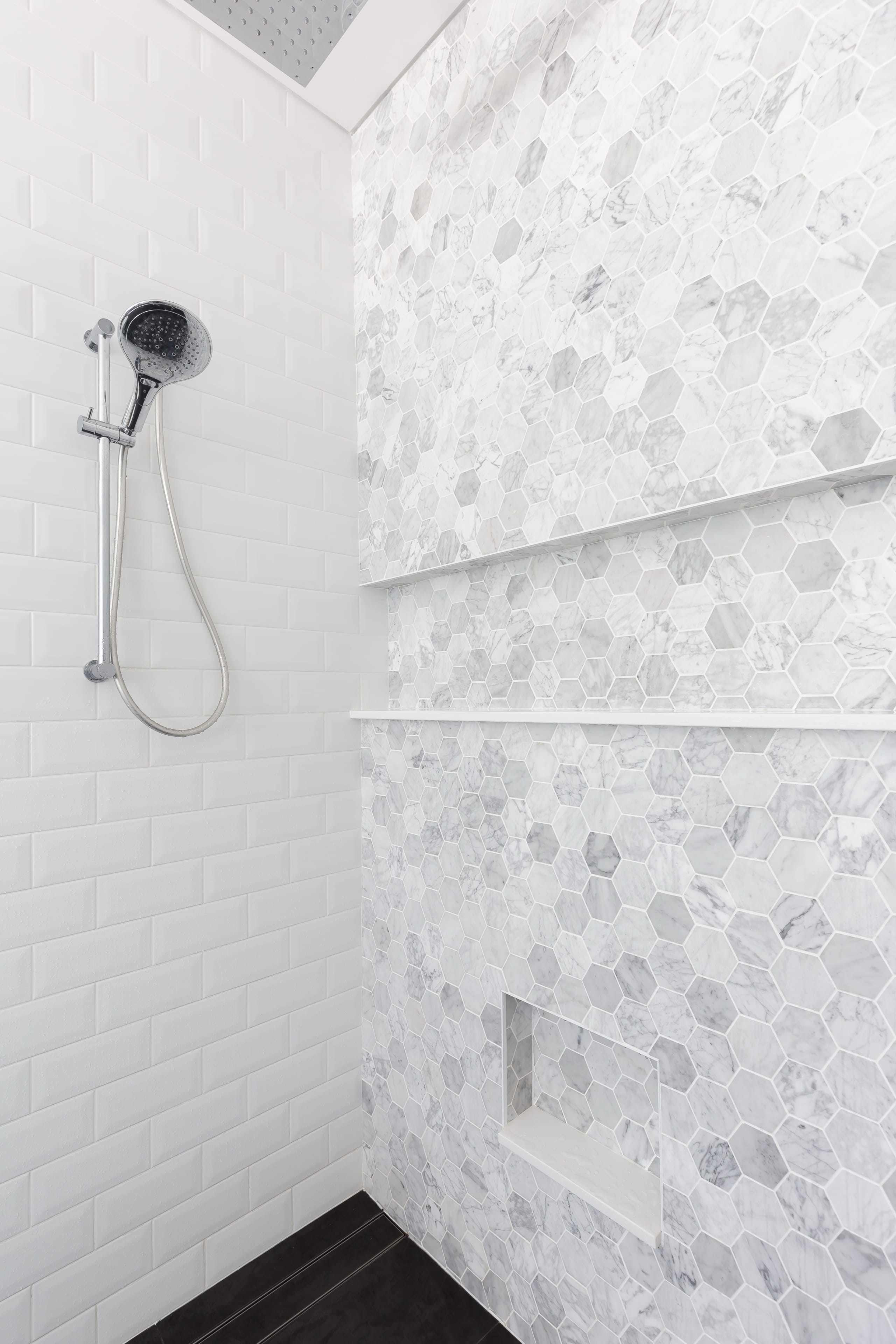 Johnston marble-lined wet area with brass detailing.