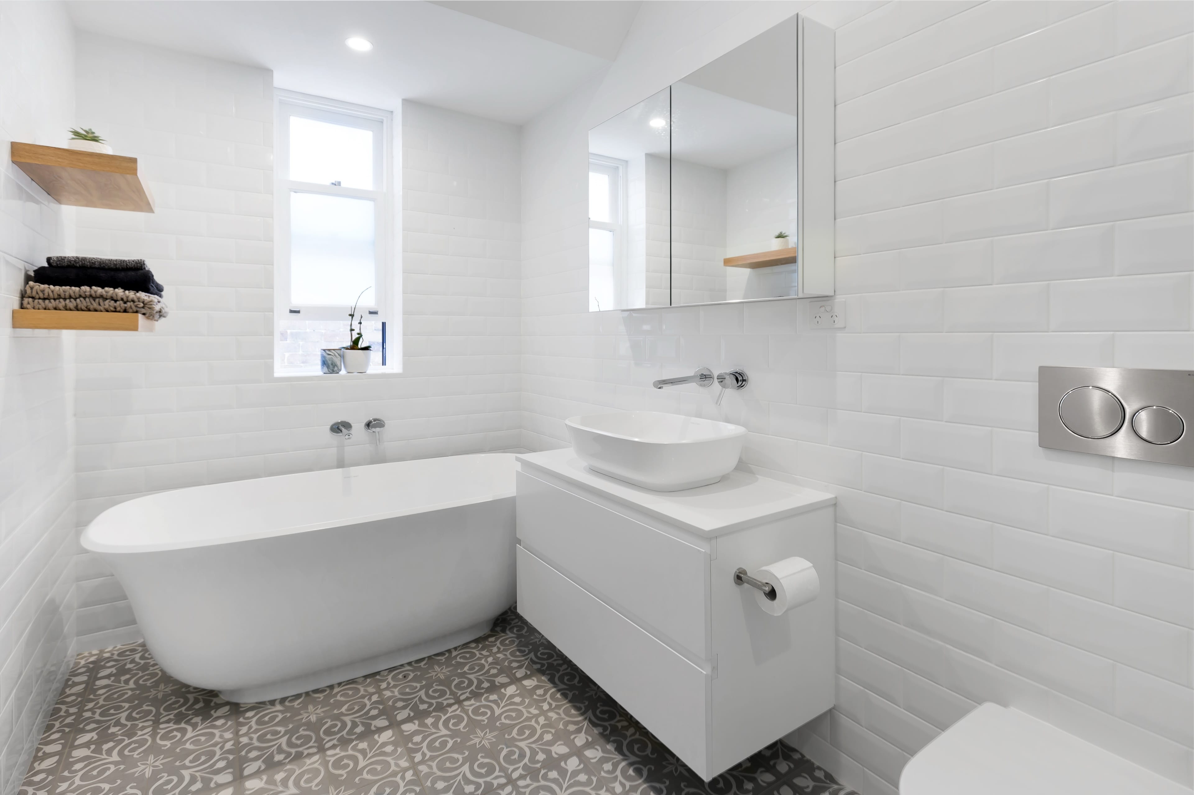 Johnston bathroom with white subway tile and twin basins.